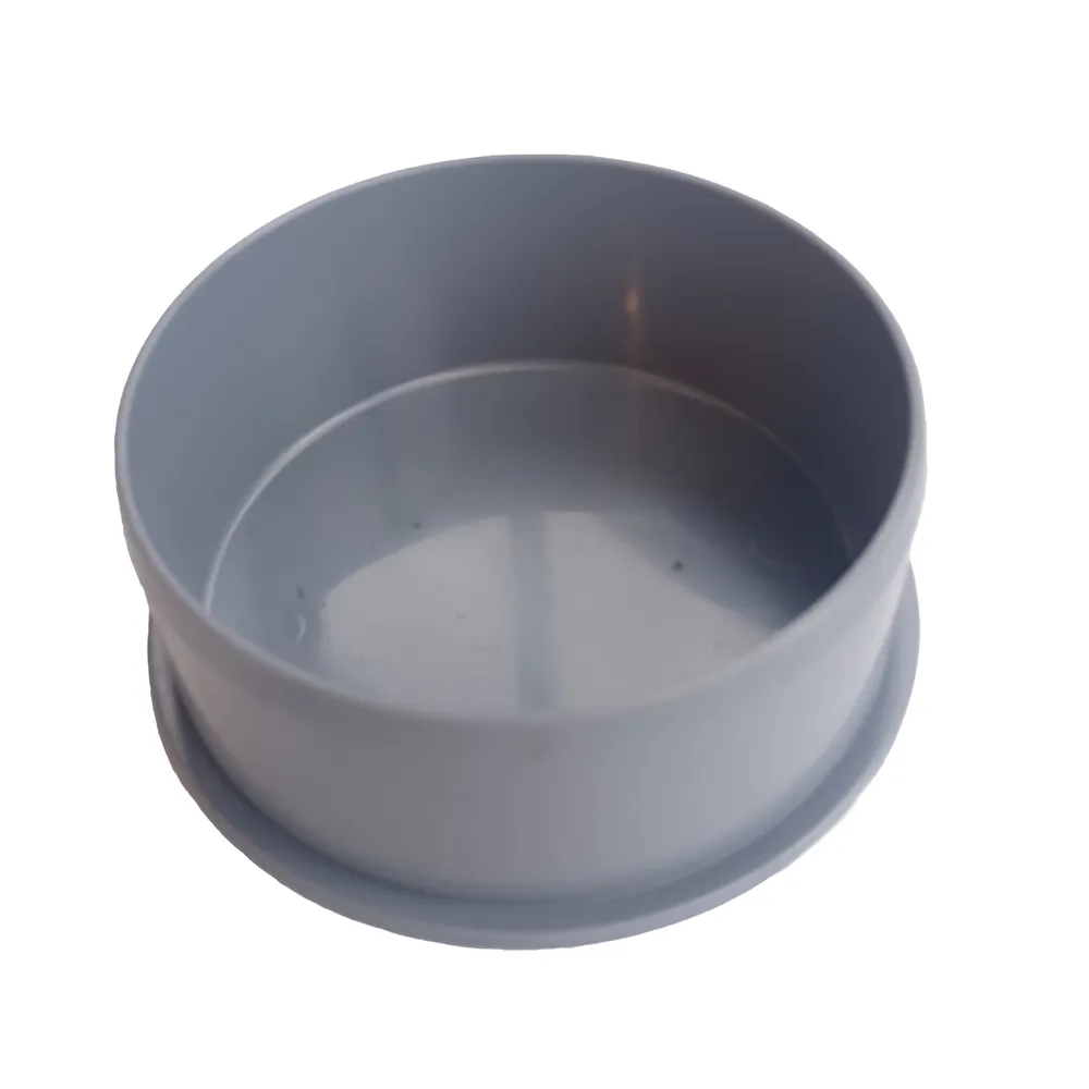 En grå HT propp 110 plastbehållare med rund botten.